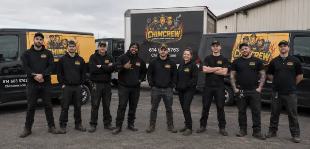The Chimcrew - Chimney Sweep & Repair team in front of their branded service vehicles in Columbus, Ohio